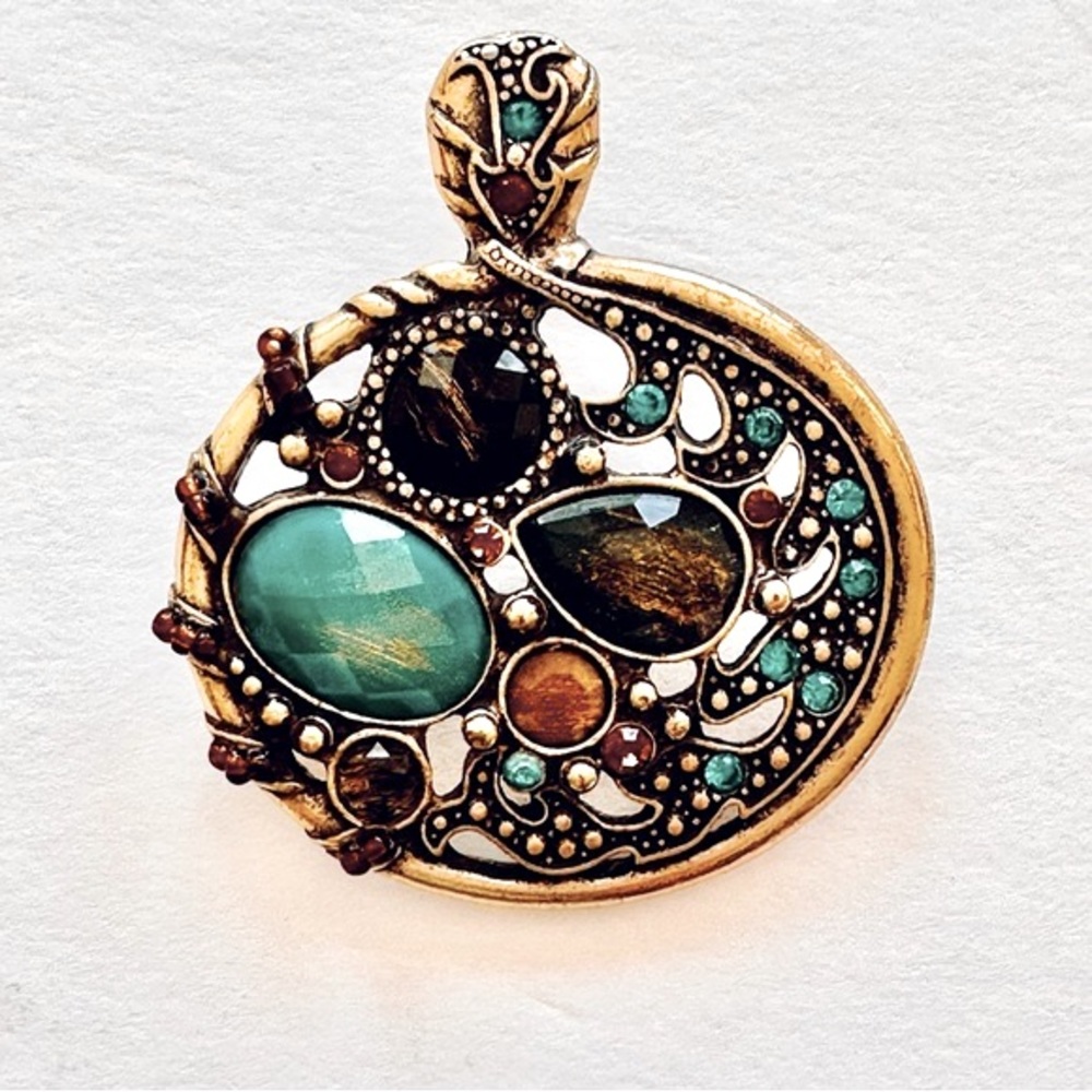 Vintage pendant with multi colored stones.